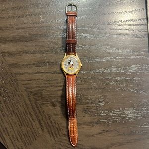 Authentic Disney watch with brown leather band.